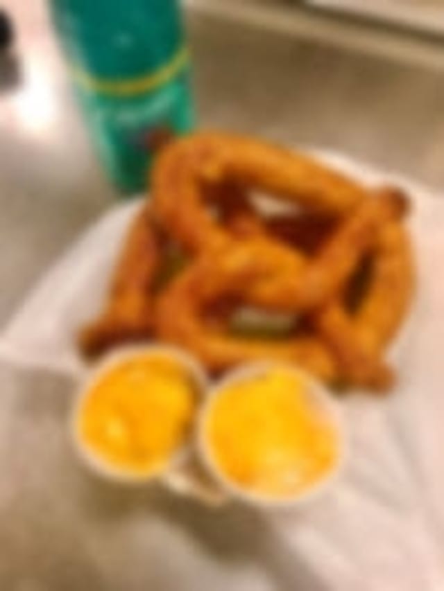 2 Pretzels w/ Cheese and Pop.